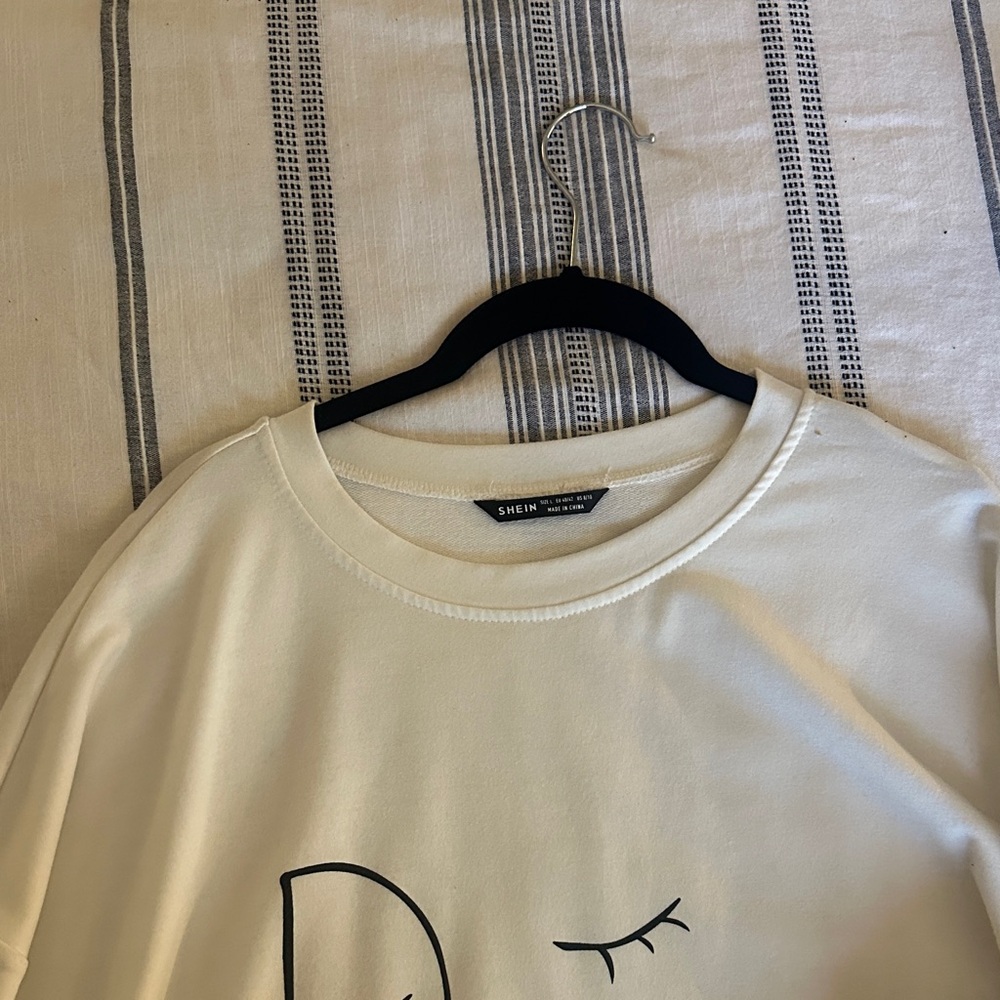 SHEIN Ivory Tee with Minimal Black Face Graphic
